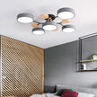 Modern ceiling light fixture in a bedroom with wooden accents