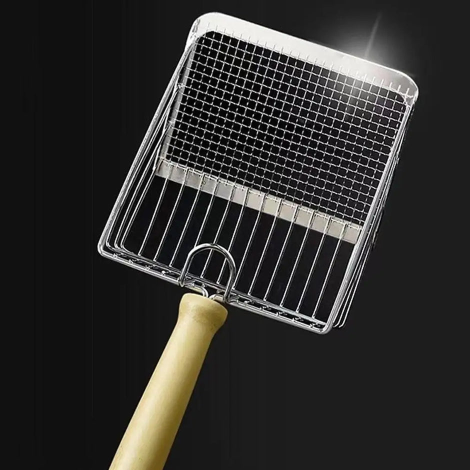 Metal grill basket with wooden handle on a black background
