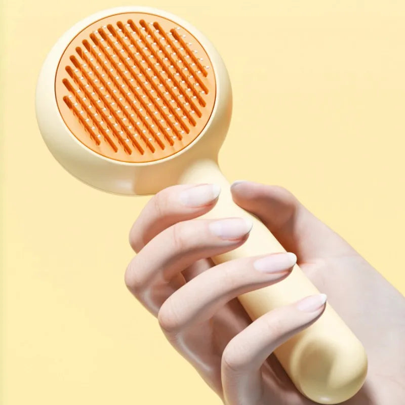 Hand holding a textured round tool against a yellow background