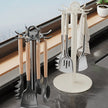 Two spatula stands with spatulas on a kitchen counter, showcasing storage solutions.
