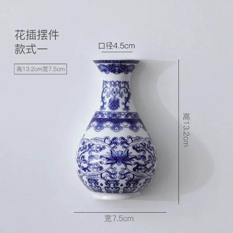 Blue and white decorative vase with floral patterns, shown with dimensions on a light gray background.