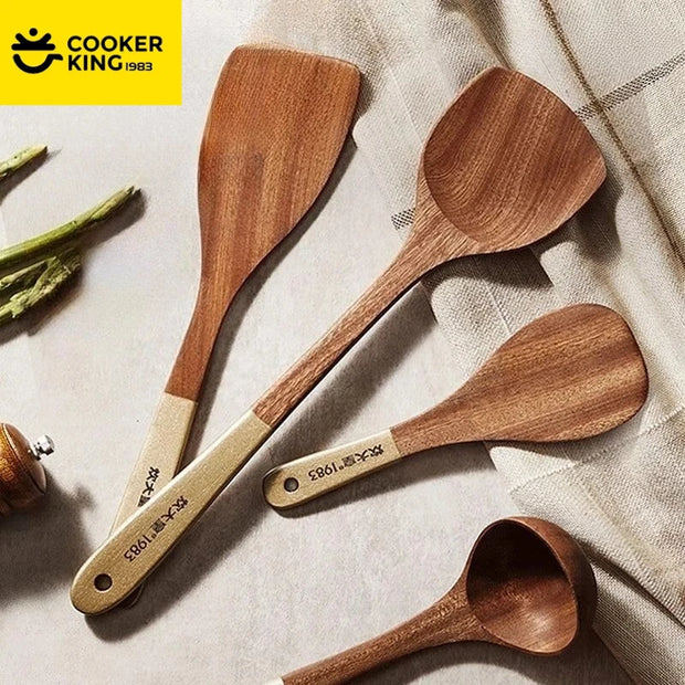 Set of wooden cooking utensils with 'Cooker King' branding on a neutral background.