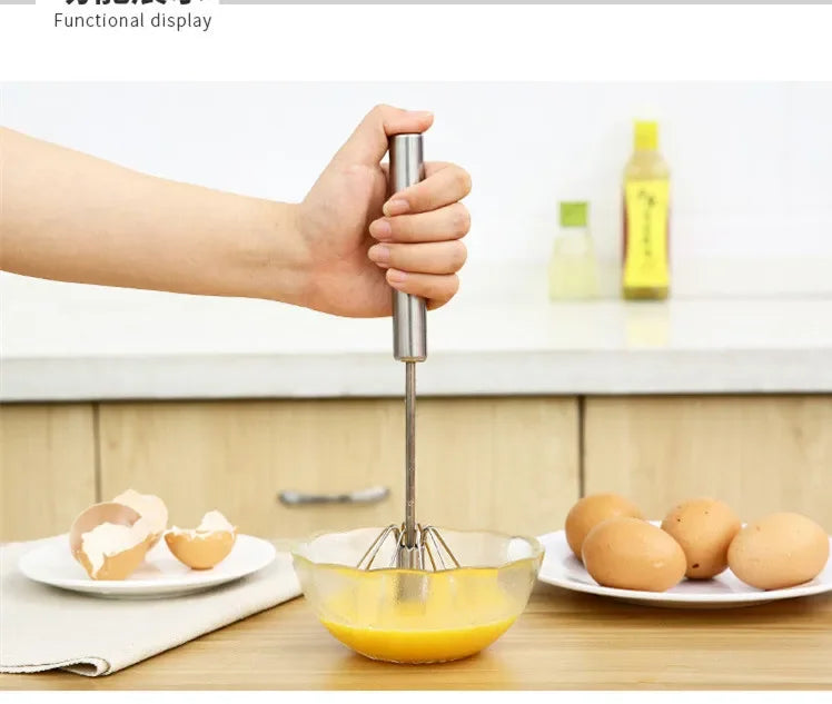Hand using a whisk to mix eggs in a bowl on a kitchen counter.