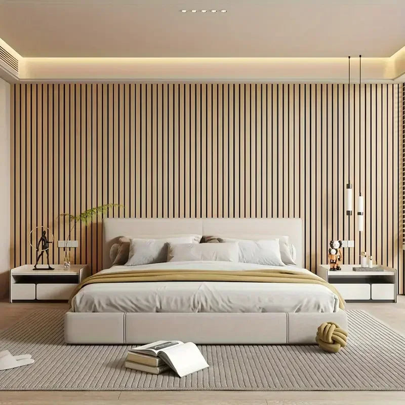 Modern bedroom with a bed, nightstands, and decorative elements.