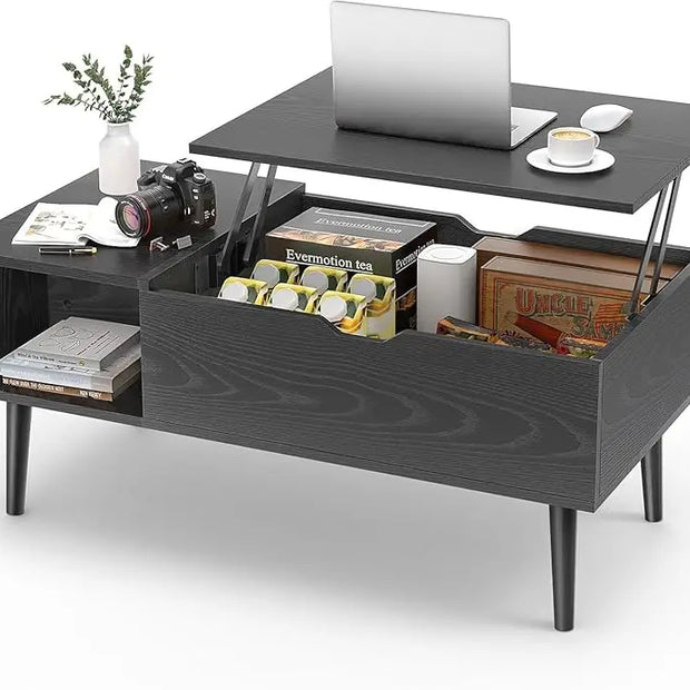 Black coffee table with lift-top design, displaying items including a laptop, camera, and books.