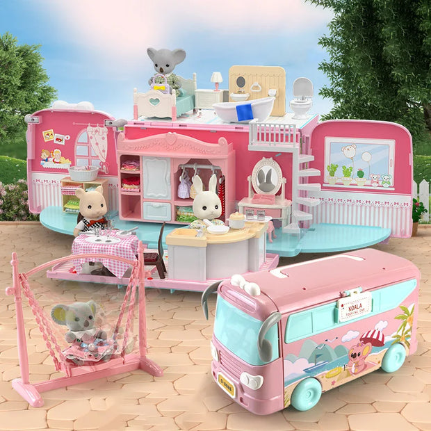 Toy camper with various rooms and a toy bus on a wooden floor.