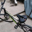 Bicycle with visible brand name on a sidewalk