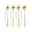 Set of four gold spoons with measurements on a white background