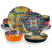 Set of colorful ceramic plates and bowls with intricate patterns on a white background