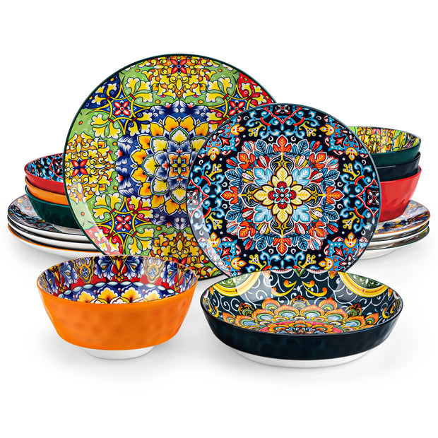Set of colorful ceramic plates and bowls with intricate patterns on a white background