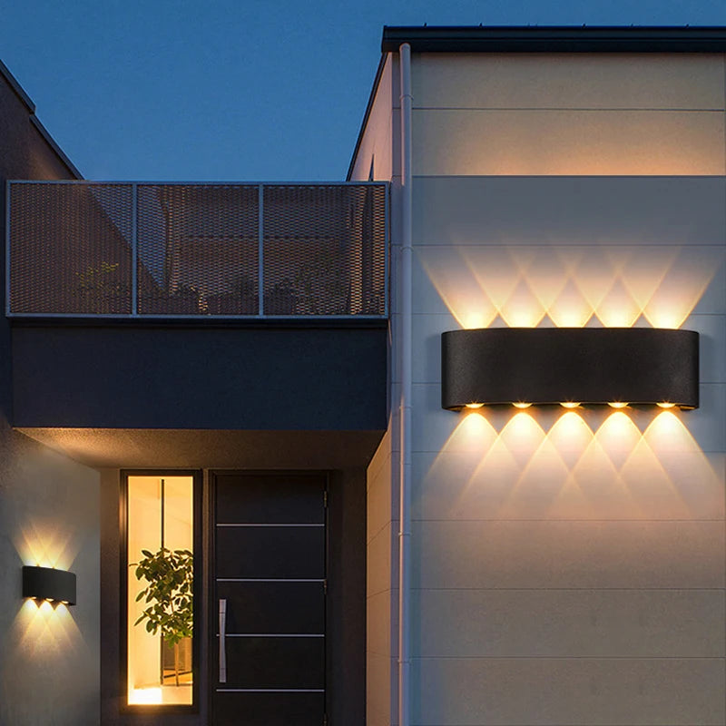 Modern building exterior with illuminated wall lights at night