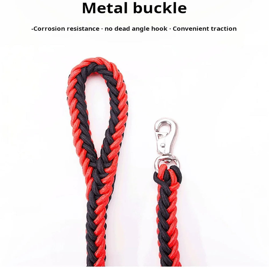 Red and black braided dog leash with metal buckle on a white background