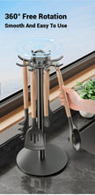 Kitchen utensil holder with 360-degree rotation on a marble surface.
