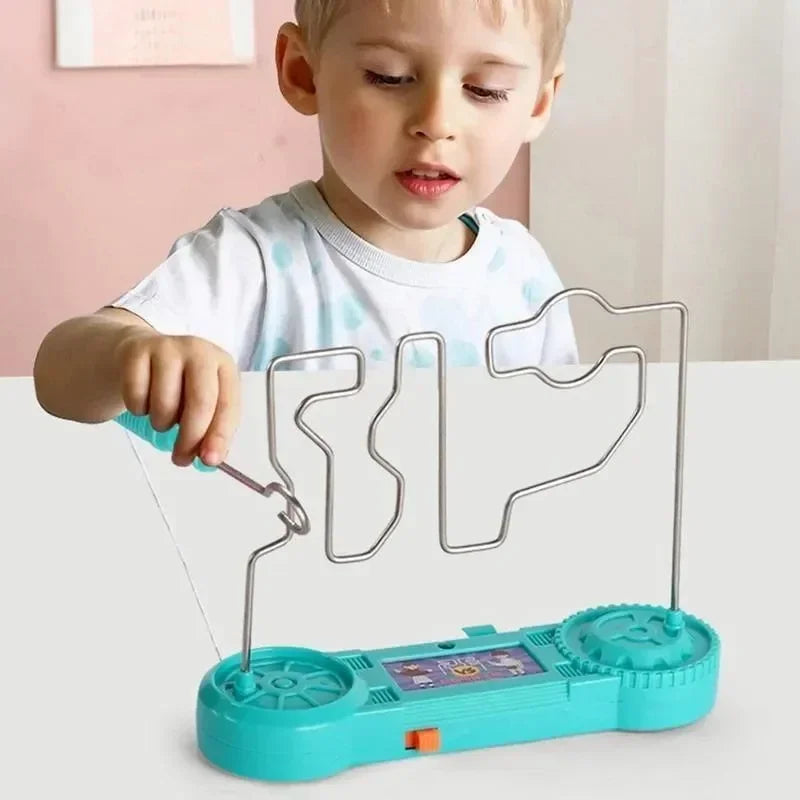 Child playing with a turquoise toy that has a transparent frame and digital display.