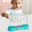Child playing with a turquoise toy that has a transparent frame and digital display.