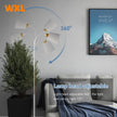 Modern floor lamp with adjustable lamp head in a living room setting, featuring WXL branding.