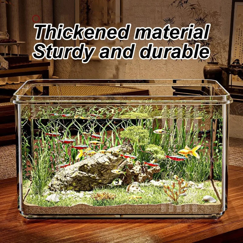 Clear fish tank with aquatic plants and fish on a wooden surface.