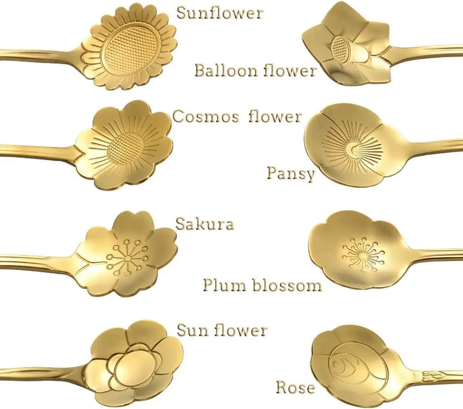Gold floral spoons with engraved designs on a white background