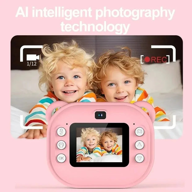 Pink children's camera with two children posing behind it on a pink background