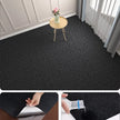 Black carpet with a small table and flowers, followed by close-up actions on the carpet.