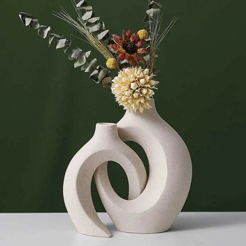 Decorative vase with floral arrangement on a dark green background