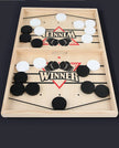 Wooden game board with hockey pucks and 'Winner' text on a dark background