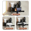 Wall-mounted hair dryer holder with different hair dryer sizes on a neutral background