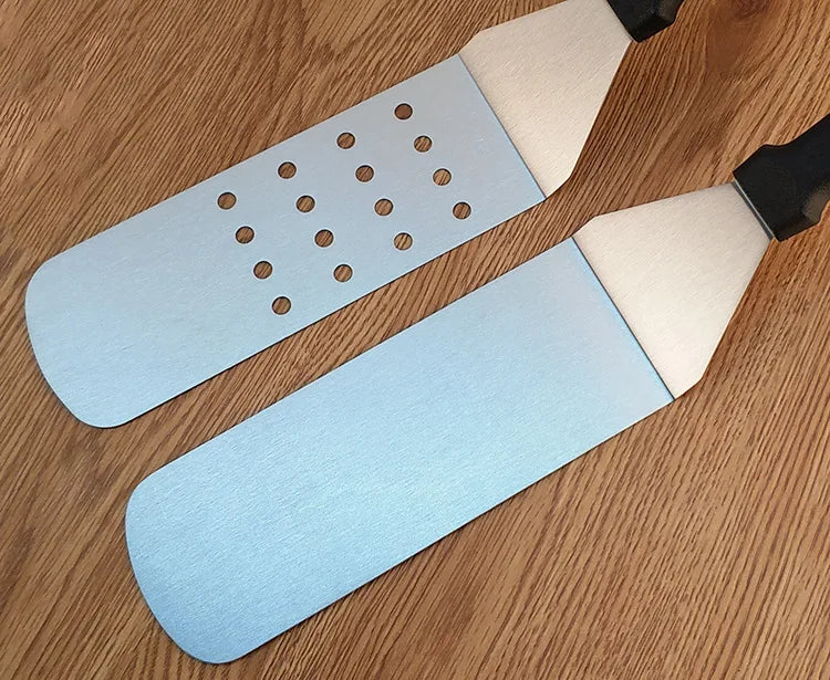 Two sanding blocks with different grits on a wooden surface