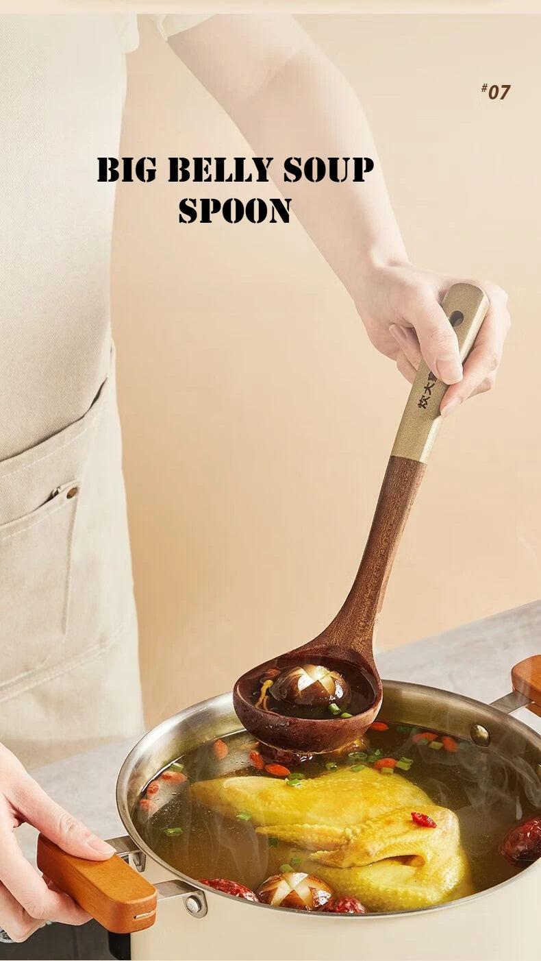 Person holding a large wooden spoon over a pot of soup with text 'BIG BELLY SOUP SPOON'.