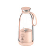Rose gold and glass juicer on a white background
