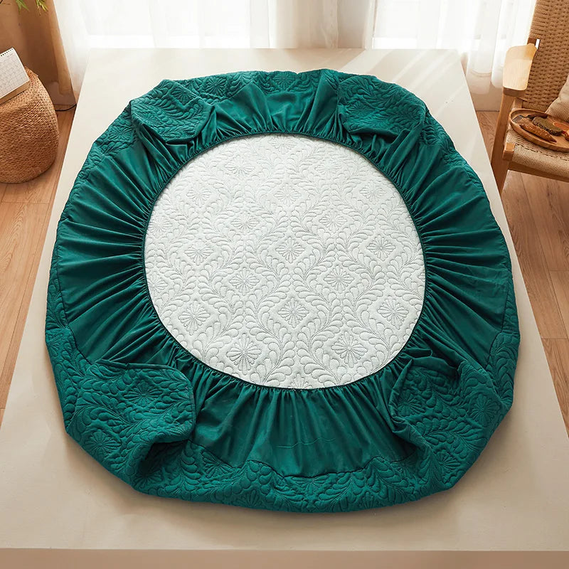 Green circular mattress cover on a bed with a white floral patterned interior.