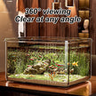 Glass aquarium with fish and plants on a wooden surface, text '360° viewing Clear at any angle' above.