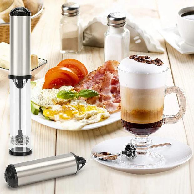 Breville coffee and espresso machine on a table with breakfast items including eggs, bacon, and a latte.