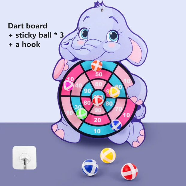 Children's dart board with elephant design, three sticky balls, and a hook on a purple background.
