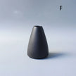 Black vase on a light gray background