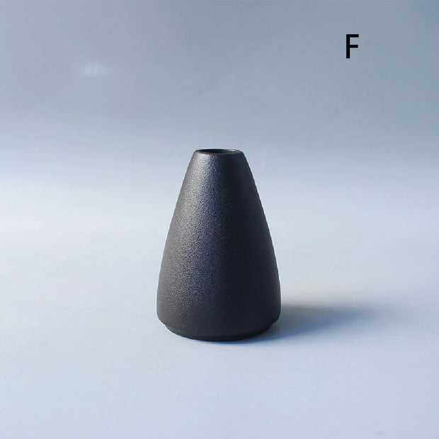 Black vase on a light gray background