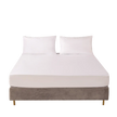 Mattress protector on a bed with two pillows on a white background