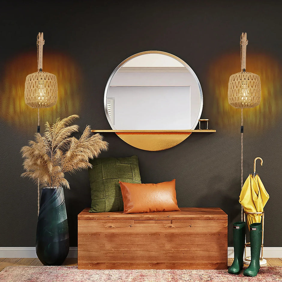 Decorative interior setting with a wooden bench, mirror, and potted plant against a dark wall.