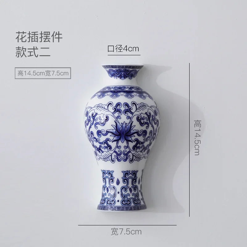 Blue and white ceramic vase with decorative patterns on a gray background