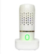 White air purifier with a green light on a white background