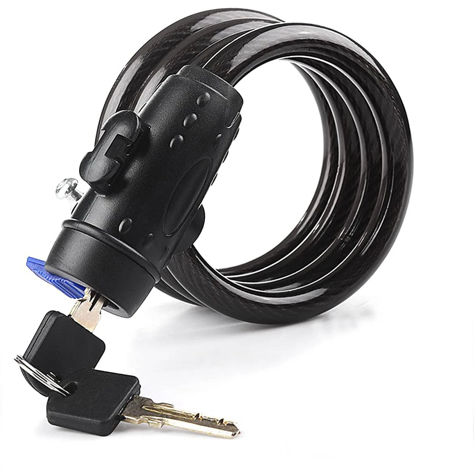 Black coiled bike lock with key on a white background