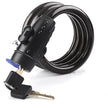 Black coiled bike lock with key on a white background