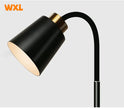 Black and gold floor lamp with WXL branding on a light gray background
