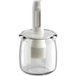 Clear glass jar with white lid and whisk attachment on a white background