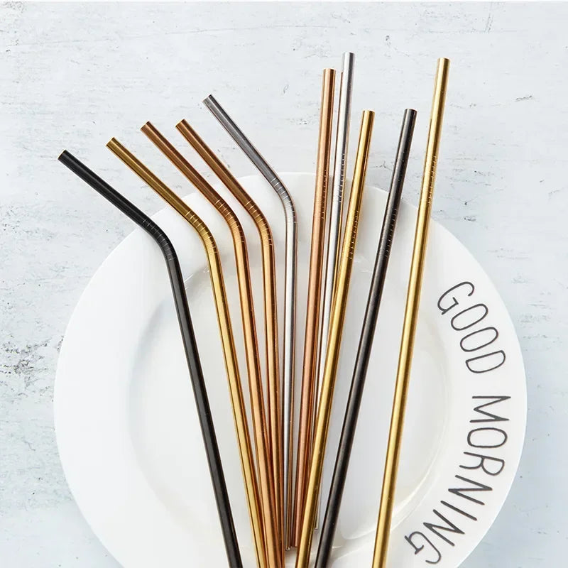 Set of metal straws in various colors on a white plate with 'Good Morning' text.