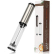 Electric milk frother with clear handle and black accents, next to its packaging on a white background.
