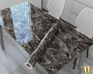 Marble-patterned table cover roll on a dining table with chairs in the background
