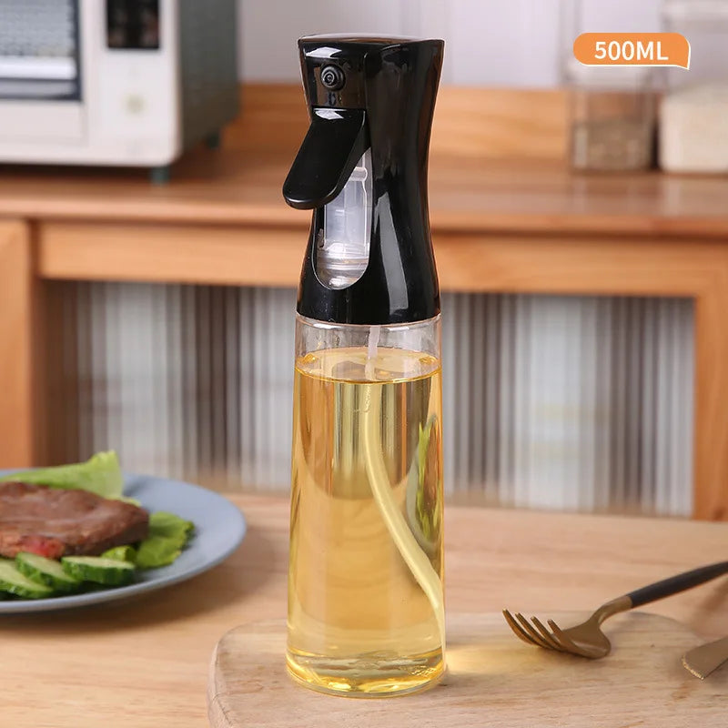 Spray bottle with oil on a kitchen counter with a plate of food in the background