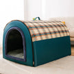 Pet bed with plaid cover on a wooden floor
