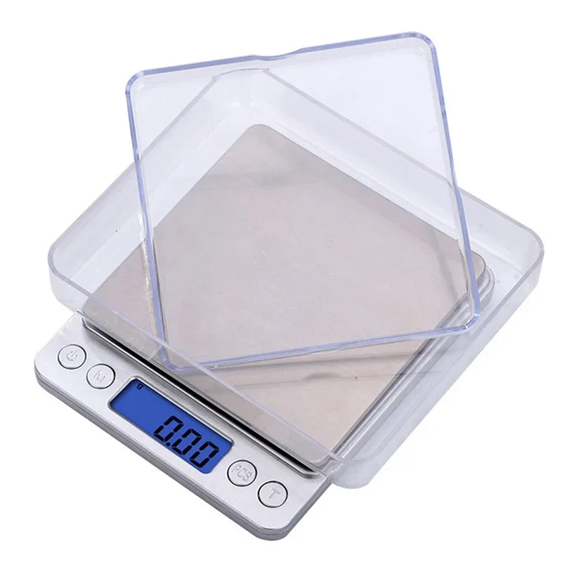 Digital kitchen scale with clear lid on a white background